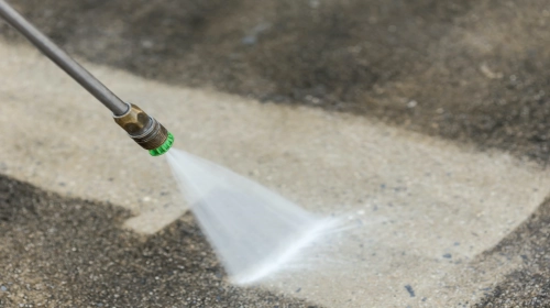 power washing a concrete surface